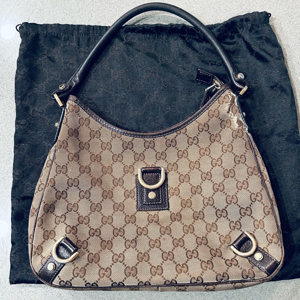 Genuine Gucci Bag with storage bag. 12 x 9 1/2 x 9.